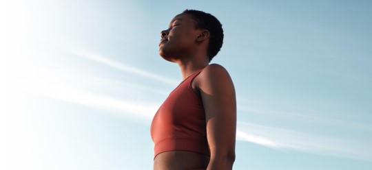 Group of men exercising in a park.